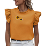 Zonnebloem Strijk Embleem Patch samen met de kleinere variant op een oranje shirtje