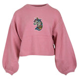 Eenhoorn Paillette Strijk Patch Embleem op een roze sweater
