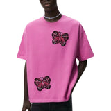 Twee maal de Vlinder Strijk Embleem L Patch op een roze t-shirt