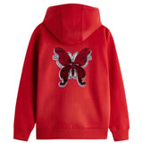 Vlinder Op Naai Embleem Patch Reversible Paillette Zilver Rood op de rugzijde van een rode hoodie