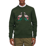 Flamingo Strijk Embleem Patch Rechts samen met de linker variant op een groene sweater
