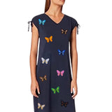 Vlinder Strijk Applicatie Embleem Patch Oranje samen met andere kleuren van deze vlinder patch op een blauwe zomerjurk