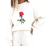 Roos Op Steel Strijk Patch Embleem op een witte sweater