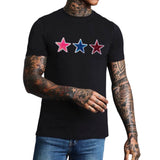 Ster Paillette Glitter Strijk Embleem Patch Roze samen met de blauwe en rode variant op een zwart T-shirt