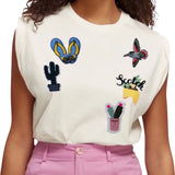 Kolibrie Vogeltjes Strijk Applicatie Patch samen met andere strijk patches op een shirtje
