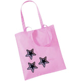Drie maal de Ster Paillette Strijk Emblemen Patch Roze Zwart op een roze canvas tas