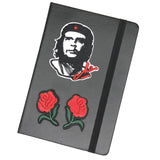Kleine Gespiegelde Rode Roosjes Strijk Patch Set samen met een andere strijk patch op de voorzijde van een zwarte agenda