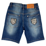 Twee Strass Rhinestone Luxe Opnaai Fashion Part Emblemen op de achterzakken van een korte blauwe spijkerbroek