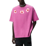 drie afbeeldingen van de Hibiscus Bloemen Full Color Strijk Applicatie op een roze t-shirtje
