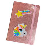 Ster Vallende Ster Regenboog Strijk Embleem Patch samen met een eenhoorn strijk patch op de voorzijde van een glitter roze agenda