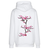 Magnolia Bloesem tak Opnaai Embleem Patch Set op de achterzijde van een witte hoodie