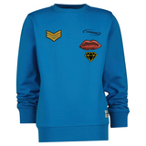 Rangstrepen Military Navy Embleem Strijk Patch Goud samen met een mond en diamant strijk patch op een blauwe sweater