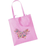  Vlinder Multicolor Full Color XL Strijk Applicatie op een roze linnen tas