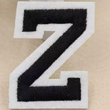Zwarte Alfabet Letter Z Met Witte Rand Strijk Patch