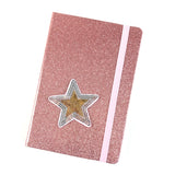 Zilver En Goudkleurige Paillette Ster Strijk Patch op de voorzijde van een roze glitter agenda