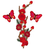 Patch set van een rode bloesem tak patch samen met twee rood en roze gekleurde vlinder patches