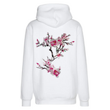 Magnolia Bloesem Tak XXL Strijk Embleem Patch Roze op de rugzijde van een witte hoodie